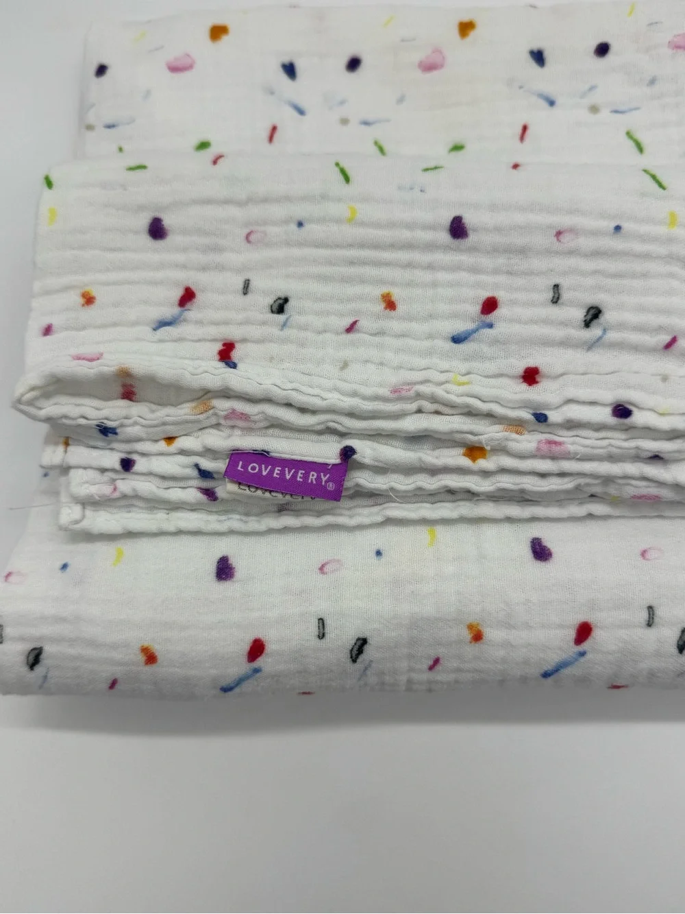 Lovevery Muslin Swaddle Blanket featuring Confetti Style Print